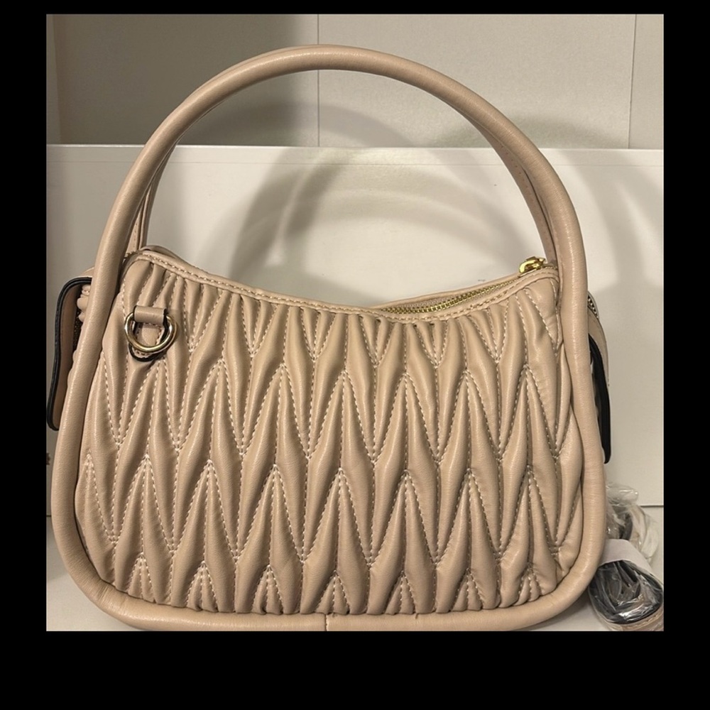 Quality handbag, double handles, 2 shoulder straps. one leather.